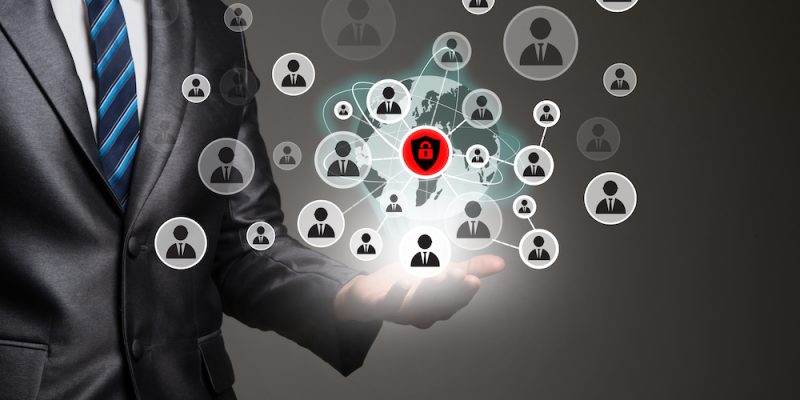 Businessman hand with people icons network connection. Business communication concept.